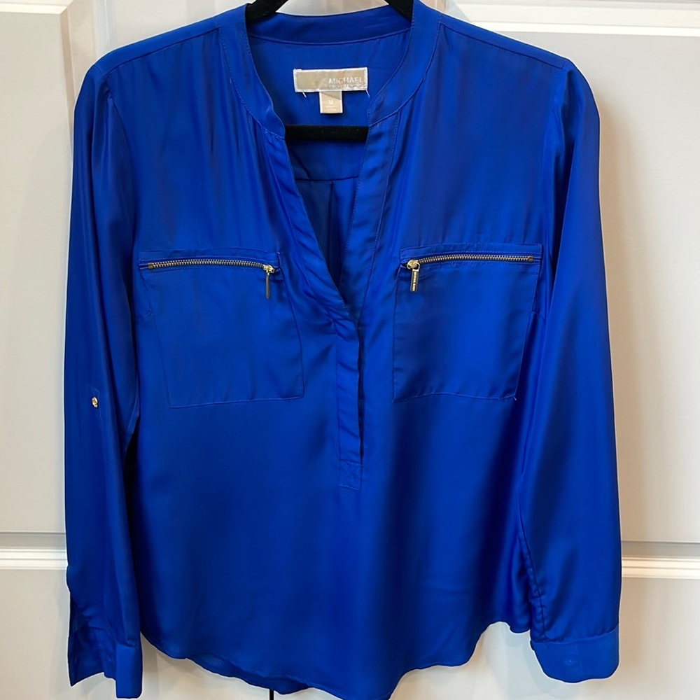 Michael Kors royal blue quarter button up blouse with gold tone zipper pockets.